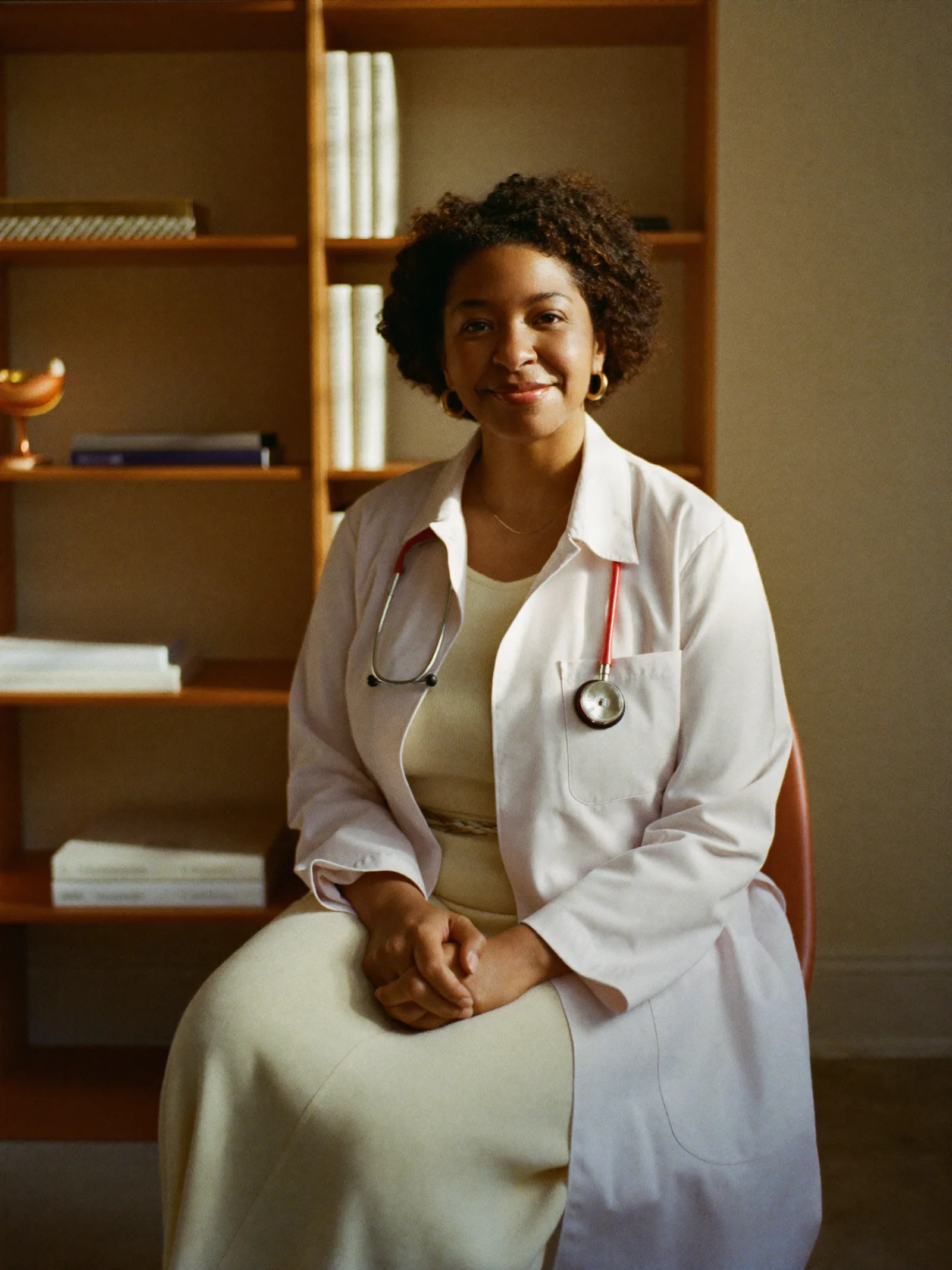 A board-certified physician reviewing a 99-biomarker peptide lab panel before prescribing